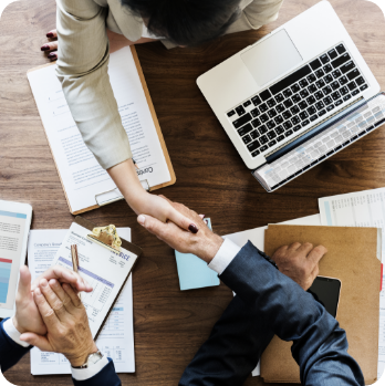 handshake between business professionals in Human Resource Management